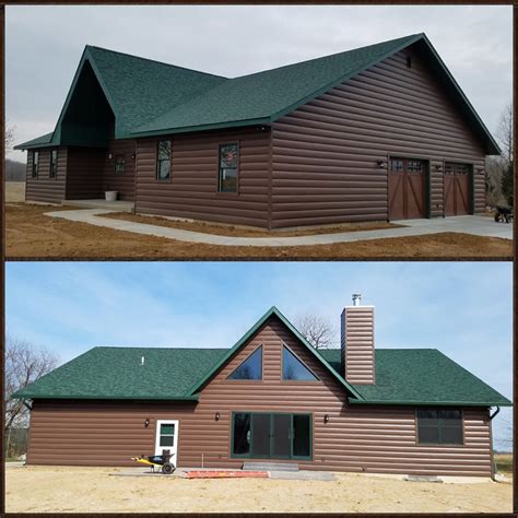 green house with brown metal roof|green siding with black trim.